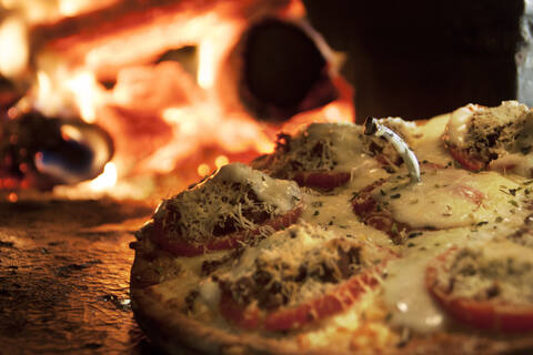 Fotografía gourmet de pizza al horno de leña de Restaurante Mafia